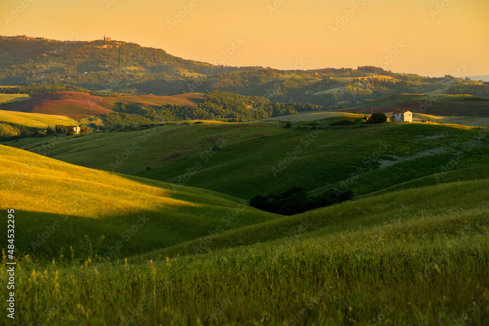 Stunning morning view of fields and farmlands with small villages on the horizon. Rural landscape of rolling hills, curved roads and cypresses of Tuscany, Italy. Stunning morning view of fields and farmlands with small villages on the horizon. Rural landscape of rolling hills, curved roads and cypresses of Tuscany, Italy.
