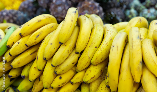 close up of mature bananas on counter in marketplace