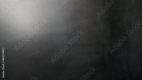 Abstract blur background with brown gray, black, white and earth tones.