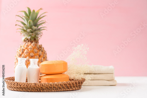 Pineapple from local market on pink background, summer vacation beach and natural spa beauty idea