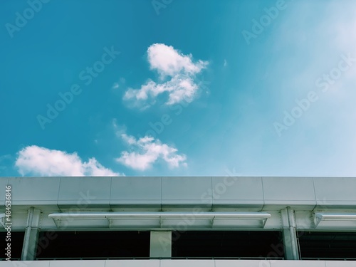 blue sky with white cloud background.