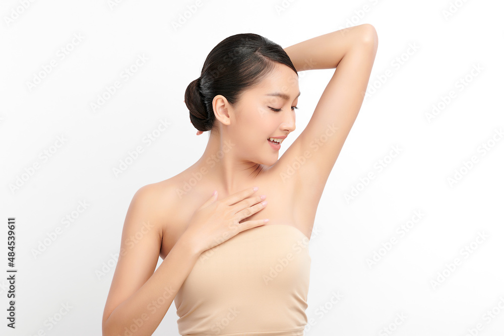 Beautiful Young Asian woman lifting hands up to show off clean and hygienic armpits or underarms on white background, Smooth armpit cleanliness and protection concept Beautiful Young Asian woman lifting hands up to show off clean and hygienic armpits or underarms on white background, Smooth armpit cleanliness and protection concept