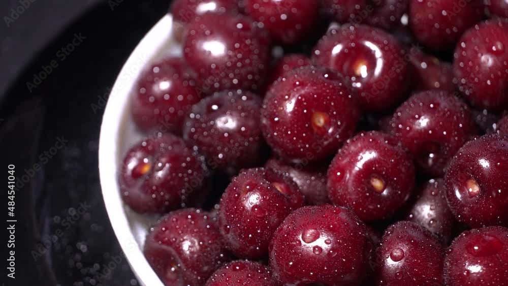 Fresh juicy red cherries rotation on a plate Fresh juicy red cherries rotation on a plate