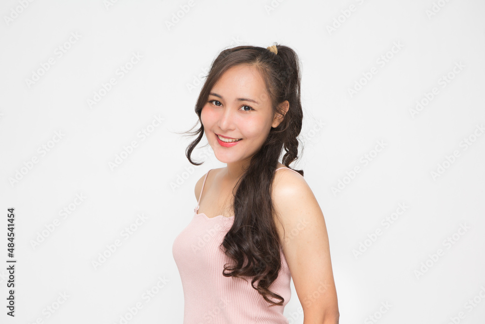 Beautiful Asian woman wearing pink casual shirt on white background and copy space.Cute Asian woman smiling and cheerful Beautiful Asian woman wearing pink casual shirt on white background and copy space.Cute Asian woman smiling and cheerful