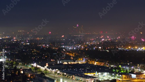 Wallpaper Mural Aerial Backward Shot Of Fireworks In Illuminated City Against Clear Sky - Los Angeles, California Torontodigital.ca