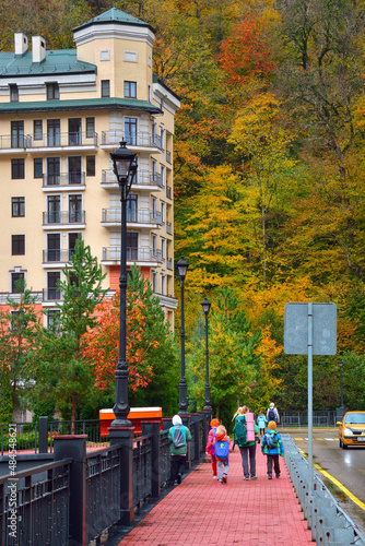 Mom and kids walk across the bridge