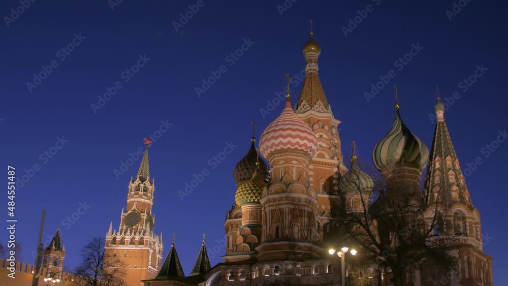 Kremlin tower and Saint Basil Cathedral against dark night sky, picturesque static shot Kremlin tower and Saint Basil Cathedral against dark night sky, picturesque static shot