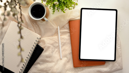 Obraz na płótnie Cozy feminine workspace with tablet computer mockup.