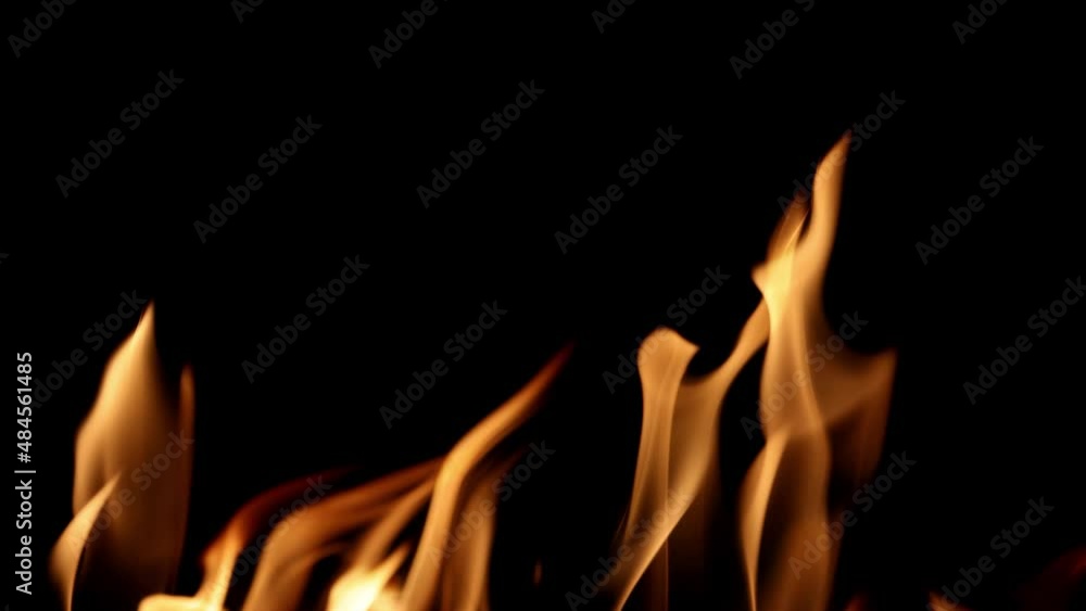 video with orange flame isolated on black background. Fire bright sparks slow motion video with orange flame isolated on black background. Fire bright sparks slow motion