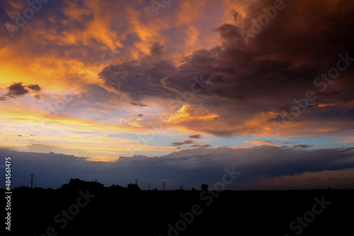 Beautiful sunset with golden orange clouds background. Dramatic background.