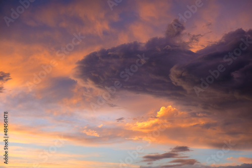 Beautiful sunset with golden orange clouds  background. Dramatic background. © Adil