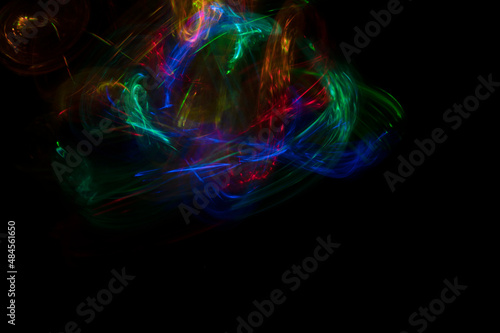 Abstract colorful blurred background on black