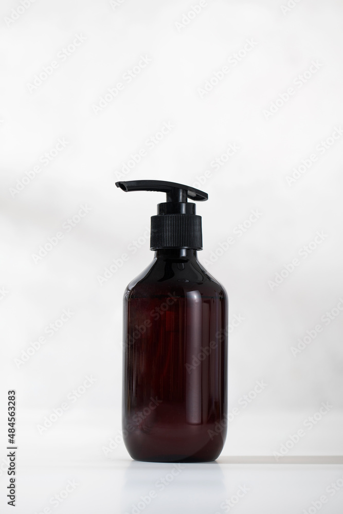 A mock-up of an organic cosmetic product in a brown dispenser on a light background. 