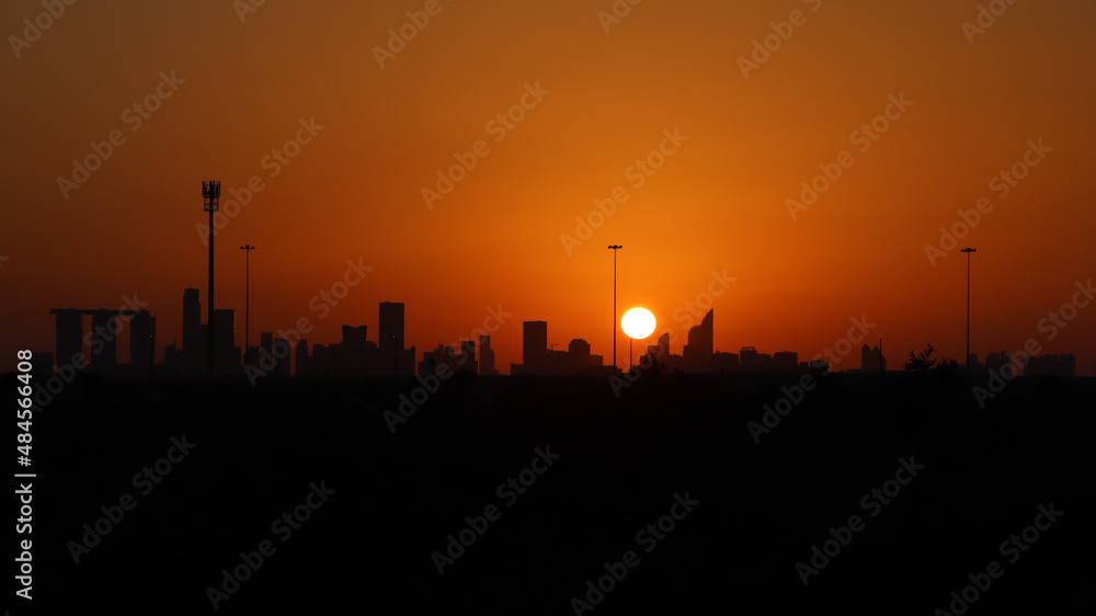 View of abu dhabi skyline during sunset from an island