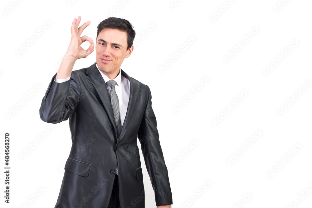 Cheerful businessman in suit showing OK gesture Cheerful businessman in suit showing OK gesture
