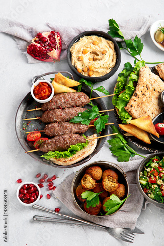 Lebanese food assortment on light background.