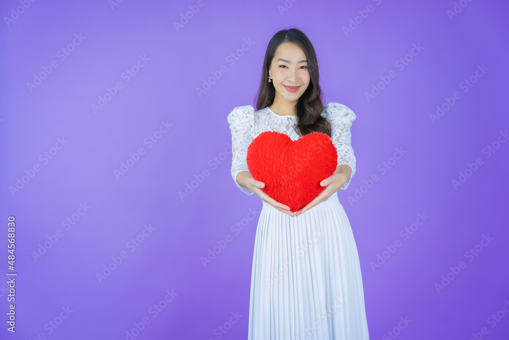 Portrait beautiful young asian woman smile with heart pillow shape Portrait beautiful young asian woman smile with heart pillow shape