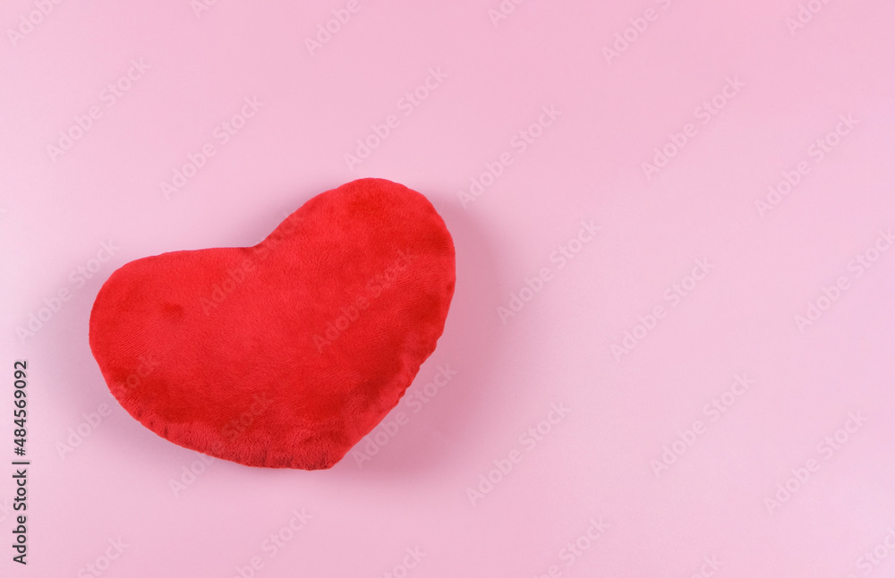  flat lay of red heart pillow on pink background with copy space, isolated. Valentine's day concept.