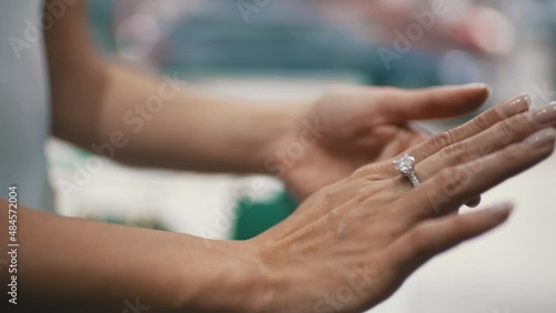 woman trying on a diamond ring