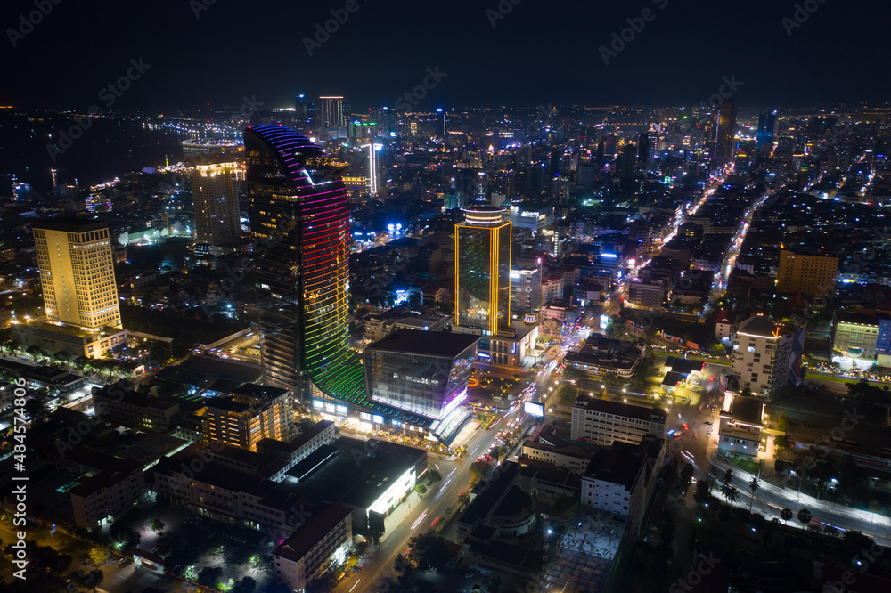 Obraz premium Top View of Building in a City - Aerial view Skyscrapers flying by drone of Phnom Penh city with downtown , riverside and sunset