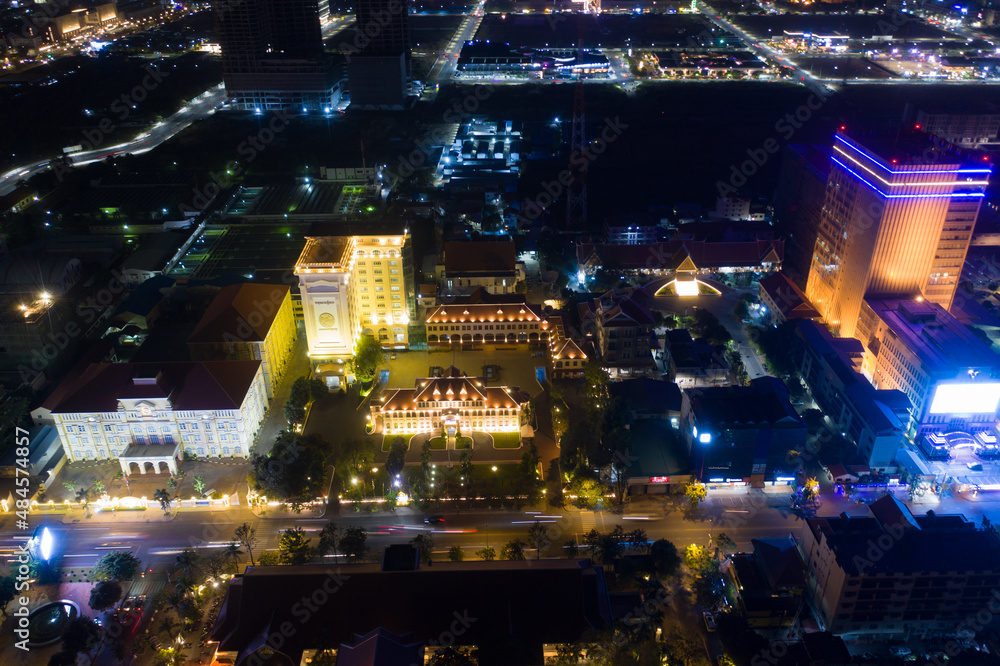 Top View of Building in a City - Aerial view Skyscrapers flying by drone of Phnom Penh city with downtown , riverside and sunset Top View of Building in a City - Aerial view Skyscrapers flying by drone of Phnom Penh city with downtown , riverside and sunset