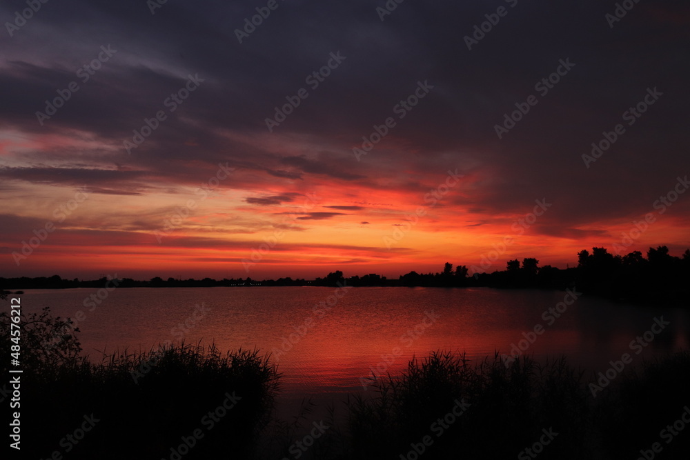 sunset over the lake sunset over the lake