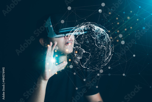 Women wear virtual reality glasses to enter the virtual world, to experience the virtual world technology, the future world, to experience entertainment through the screen.VR