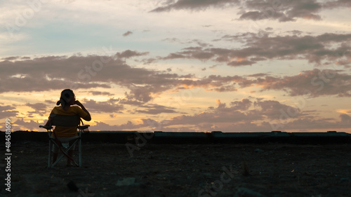 silhouette of a person with a backpack at sunset time cover banner concept background.