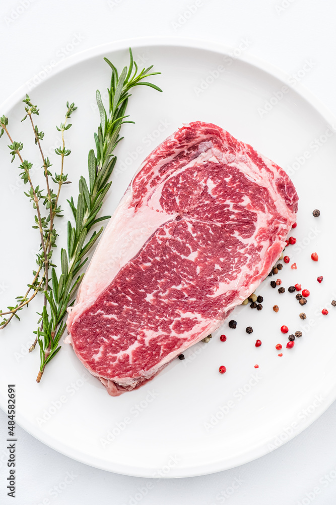 Fototapeta premium Close up beef rib eye steak isolated on white