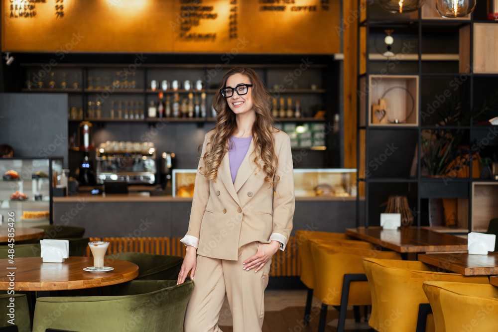 Business Woman Restaurant Owner Dressed Elegant Pantsuit Standing In Restaurant With Bar Counter Background Business Woman Restaurant Owner Dressed Elegant Pantsuit Standing In Restaurant With Bar Counter Background