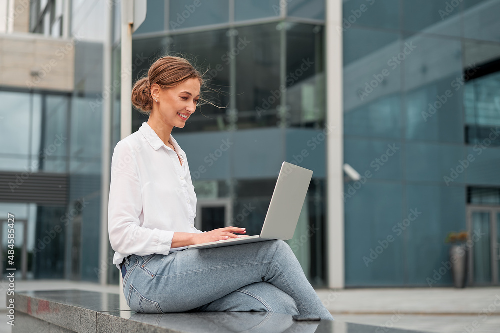 Businesswoman successful woman business person outdoor corporate building exterior. Pensive caucasian confidence professional business woman middle age