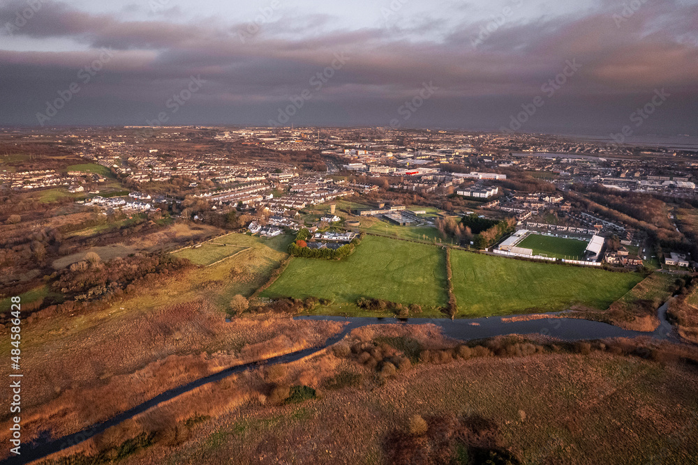 Aerial view on Galway city, Deacy Park and Terryland area. Calm sunset color. River Coribb in in foreground.