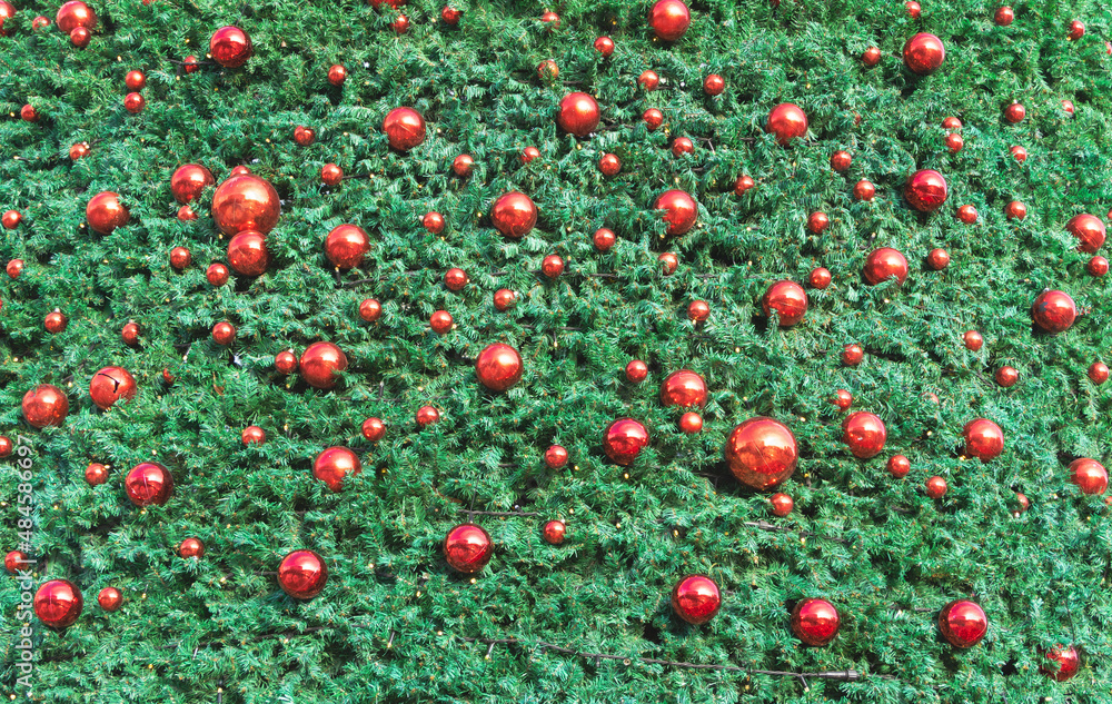 Close up texture af a christmas tree decorated with red balls