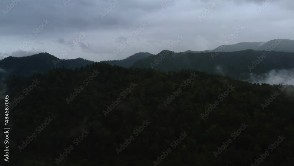 mountains and forest in the clouds view from above mountains and forest in the clouds view from above