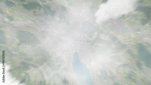 Earth zoom in from outer space to city. Zooming on Zurich, Switzerland. The animation continues by zoom out through clouds and atmosphere into space. View of the Earth at night. Images from NASA. 4K