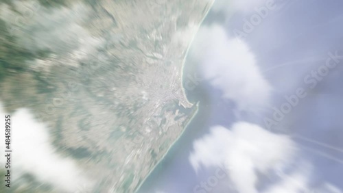 Earth zoom in from outer space to city. Zooming on Durban, South Africa. The animation continues by zoom out through clouds and atmosphere into space. View of the Earth at night. Images from NASA. 4K photo