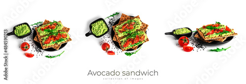 Fototapeta Naklejka Na Ścianę i Meble -  Avocado sandwich with avocado cream and rye crisp bread for snack. Fiber, fitness and diet food. Rye bread with guacamole, arugula and cherry tomatoes isolated on a white background.