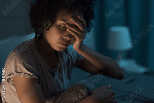 Depressed woman suffering from insomnia photo