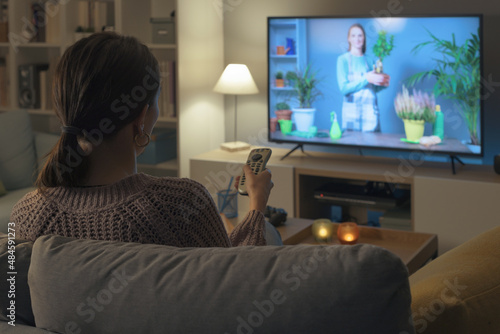 Woman watching a TV show about gardening