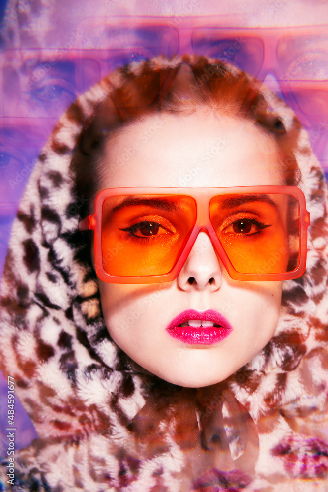 fashionable woman in orange glasses and leopard hood with pink lipstick on her lips