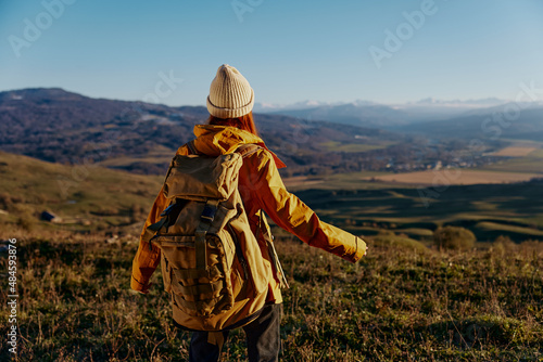 woman tourist backpacking trip to mountains landscape Fresh air