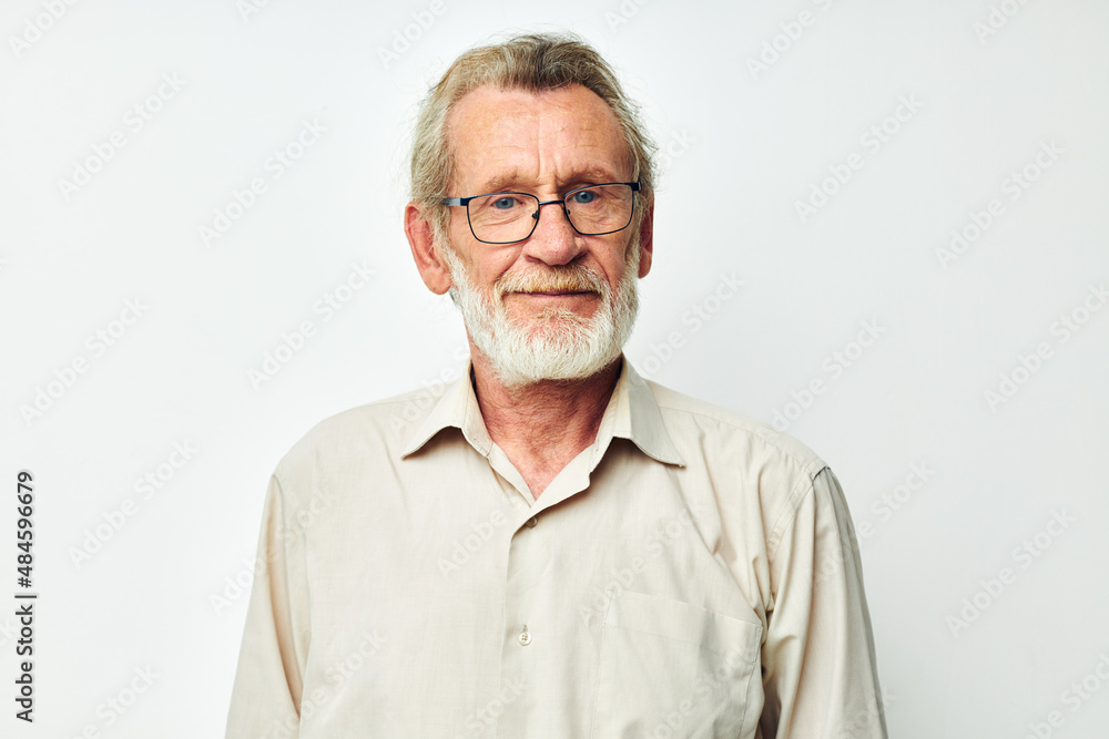 Senior grey-haired man smile emotion hand gesture light background Senior grey-haired man smile emotion hand gesture light background