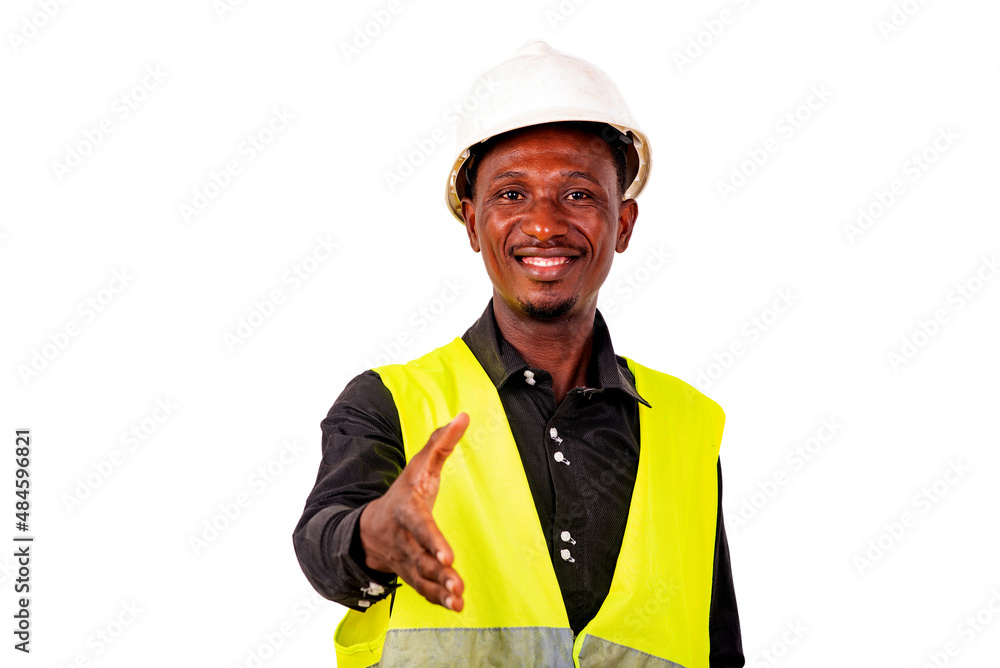young male construction engineer offering a handshake smiling. young male construction engineer offering a handshake smiling.