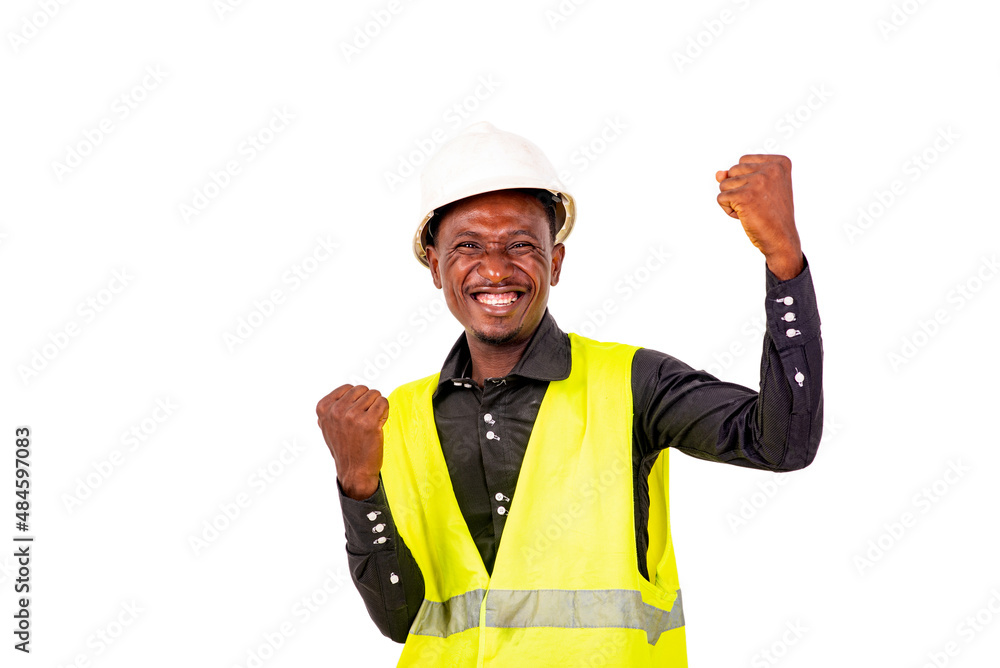 young happy engineer man making a winning gesture. young happy engineer man making a winning gesture.