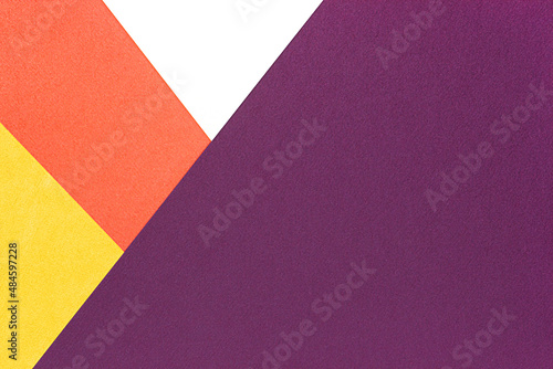 yellow, orange and white stripes on a purple background