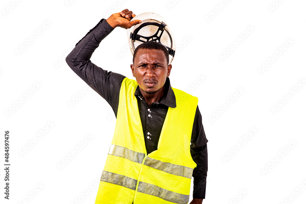 furious young engineer man holding helmet near his head. furious young engineer man holding helmet near his head.