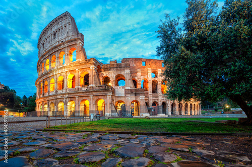 Coliseum morning in Rome  Italy. Coliseum is one of the main attractions of Rome. Coliseum is reflected in puddle. Rome architecture and landmark.