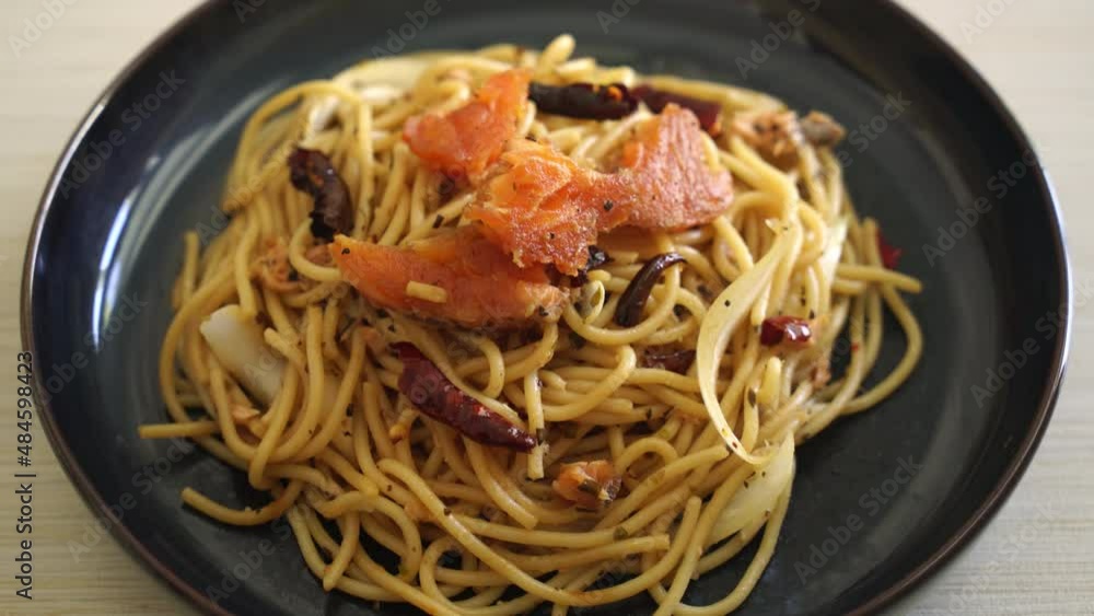 stir-fried spaghetti with salmon and dried chilli - fusion food style stir-fried spaghetti with salmon and dried chilli - fusion food style