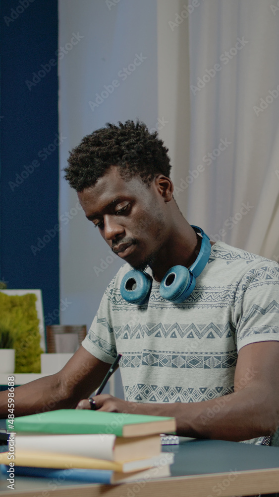 Person working with stock market data for financial information on computer. Man looking at crypto currency trade value while writing numbers and investment charts on notebook. Person working with stock market data for financial information on computer. Man looking at crypto currency trade value while writing numbers and investment charts on notebook.