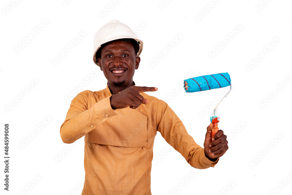 young businessman architect pointing finger at brush roll smiling. young businessman architect pointing finger at brush roll smiling.